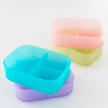 Load image into Gallery viewer, Four bento boxes, including a Bumkins Silicone Bento Box 3 Section: Blue Jelly, are arranged on a white background.
