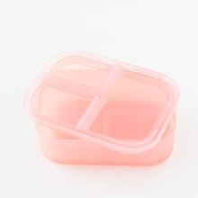Load image into Gallery viewer, Bumkins Silicone Bento Box 3 Section: Pink Jelly, with lid askew, sits on a white background.
