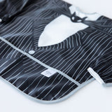 Close-up of Bumkins Sleeved Bib: Jack Skellington on a white background, showcasing the outer pocket.