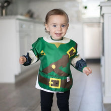 Load image into Gallery viewer, A toddler beams in a kitchen, wearing a Bumkins Sleeved Bib: Zelda™.
