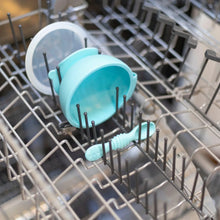 Load image into Gallery viewer, Bumkins Silicone First Feeding Set: Blue sits in the top rack of an open dishwasher.
