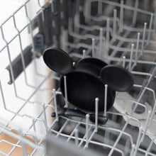 Load image into Gallery viewer, Bumkins Silicone First Feeding Set: Mickey Mouse Classic Black sits in the top rack of an open dishwasher.
