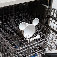Load image into Gallery viewer, Bumkins Silicone First Feeding Set: Mickey Mouse Vanilla Sprinkle sits in the top rack of an open dishwasher.
