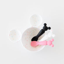 Load image into Gallery viewer, Bumkins Silicone First Feeding Set: Mickey Mouse Vanilla Sprinkle sits on a white background with black and pink baby spoons.
