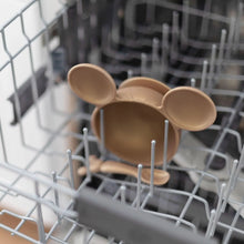 Load image into Gallery viewer, Bumkins Silicone First Feeding Set: Minnie Mouse sits in the top rack of an open dishwasher.

