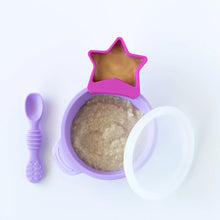Load image into Gallery viewer, Bumkins Silicone First Feeding Set: Lavender with oatmeal and a pink star-shaped cup of peanut butter sit on a white background.

