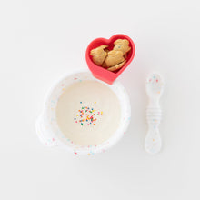 Load image into Gallery viewer, Bumkins Silicone First Feeding Set: Vanilla Sprinkle filled with yogurt &amp; sprinkles, and a heart-shaped cup of cookies on a white background.
