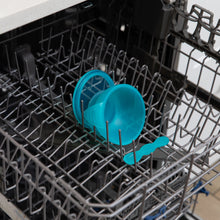 Load image into Gallery viewer, Bumkins Silicone First Feeding Set: Blue Jelly sits in the top rack of an open dishwasher.
