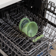 Load image into Gallery viewer, Bumkins Silicone First Feeding Set: Green Jelly sits in the top rack of an open dishwasher.
