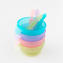 Load image into Gallery viewer, A stack of four colorful bowls with spoons, on a white background, including Bumkins Silicone First Feeding Set: Pink Jelly.
