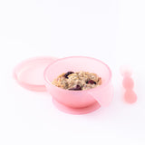 Bumkins Silicone First Feeding Set: Pink Jelly holds oatmeal and berries on a white background.