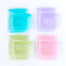 Load image into Gallery viewer, Bumkins Silicone Flat Reusable Bag 2 Pack, Lavender and three other bag sets are arranged on a white background.
