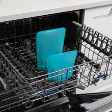 Load image into Gallery viewer, Bumkins Silicone Flat Reusable Bag 2 Pack, Blue sits in the top rack of an open dishwasher.
