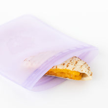 Load image into Gallery viewer, A sandwich with melted cheese is visible inside an open Bumkins Silicone Flat Reusable Bag 2 Pack, Lavender on a white background.
