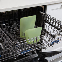 Load image into Gallery viewer, Bumkins Silicone Flat Reusable Bag 2 Pack, Sage sits in the top rack of an open dishwasher.
