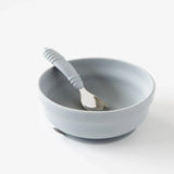 Bumkins Silicone Grip Bowl: Gray sits with a matching spoon inside on a white background.