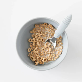 Bumkins Silicone Grip Bowl: Gray with cereal and milk, and a matching spoon on a white background.
