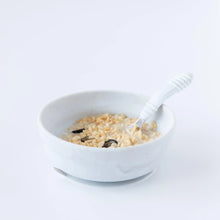 Load image into Gallery viewer, Bumkins Silicone Grip Bowl: Marble with cereal, milk, and fruit, with a matching spoon on a white background.
