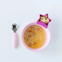 Load image into Gallery viewer, Bumkins Silicone Grip Bowl: Pink holds soup with rice, while a star-shaped cup of crackers and a pink spoon sit nearby on a white background.

