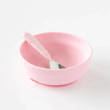 Bumkins Silicone Grip Bowl: Pink sits with a pink spoon inside on a white background.