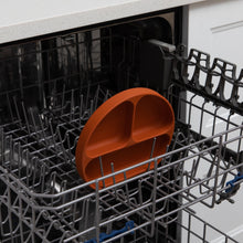 Load image into Gallery viewer, Bumkins Silicone Grip Dish: Clay sits in the top rack of an open dishwasher.
