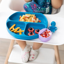 Load image into Gallery viewer, Close-up of a toddler in a high chair with a Bumkins Silicone Grip Dish: Dark Blue with pasta and cheese, and purple cup of fruit and yogurt.
