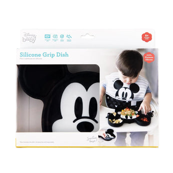 Bumkins Silicone Grip Dish: Mickey Mouse in a white packaging box with a photo of a child and a clear window partially displaying the dish.