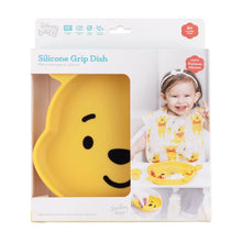 Load image into Gallery viewer, Bumkins Silicone Grip Dish: Winnie The Pooh in a white packaging box with a photo of a child and a clear window partially displaying the dish.
