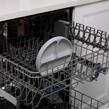 Load image into Gallery viewer, Bumkins Silicone Grip Dish: Gray sits in the top rack of an open dishwasher.
