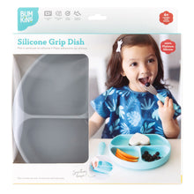 Load image into Gallery viewer, Bumkins Silicone Grip Dish: Gray in a white packaging box with a photo of a child and a clear window partially displaying the dish.
