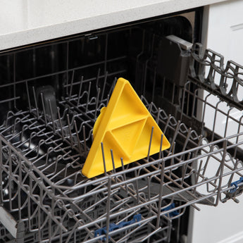 Bumkins Silicone Grip Dish: Zelda™ Triforce sits in the top rack of an open dishwasher.