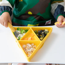Load image into Gallery viewer, A child enjoys snacks from a Bumkins Silicone Grip Dish: Zelda™ Triforce filled with broccoli, fruit, and chicken on a high chair tray.
