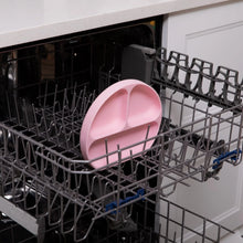 Load image into Gallery viewer, Bumkins Silicone Grip Dish: Pink sits in the top rack of an open dishwasher.
