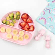 Load image into Gallery viewer, Bumkins Silicone Grip Dish: Pink with avocado and fruit on a white background, with pink toddler utensils and a rainbow-print pouch nearby.
