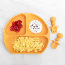 Load image into Gallery viewer, Bumkins Silicone Grip Dish: Tangerine holds berries, yogurt, and scrambled eggs next to orange toddler utensils on a marble background.
