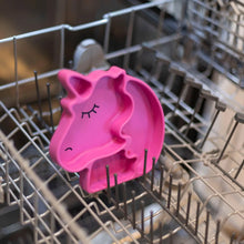 Load image into Gallery viewer, Bumkins Silicone Grip Dish Special Edition: Unicorn sits in the top rack of an open dishwasher.
