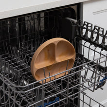 Load image into Gallery viewer, Bumkins Silicone Grip Dish: Wood Grain sits in the top rack of an open dishwasher.
