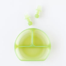 Load image into Gallery viewer, Bumkins Silicone Chewtensils®: Green Jelly rest above a matching divided plate on a white background.
