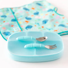 Load image into Gallery viewer, Bumkins Silicone Grip Dish with Lid (5 Section): Blue sits on a white background with utensils on top and a blue bib in the background.
