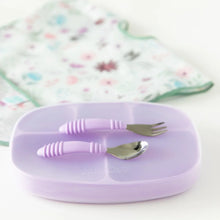 Load image into Gallery viewer, Bumkins Silicone Grip Dish with Lid (5 Section): Lavender sits on a white background with utensils on top, and a floral bib in the backdrop.
