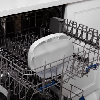 Bumkins Silicone Grip Dish with Lid (5 Section): Marble sits in the top rack of an open dishwasher.