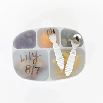 Bumkins Silicone Grip Dish with Lid (5 Section): Marble, with lid labeled Lily 8/7, holds food with utensils on top on a white background.