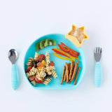 Bumkins Silicone Grip Plate: Blue with pasta salad, kiwi, peppers, and pretzels,  a star-shaped cup of hummus, and blue utensils on a white background.