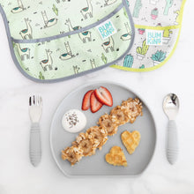 Load image into Gallery viewer, Bumkins Silicone Grip Plate: Gray with waffles, yogurt, strawberries, and granola lays near utensils and two bibs on a marble background.
