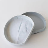 Bumkins Silicone Grip Plate: Marble sits slightly askew on top of a similar gray plate on a white background.
