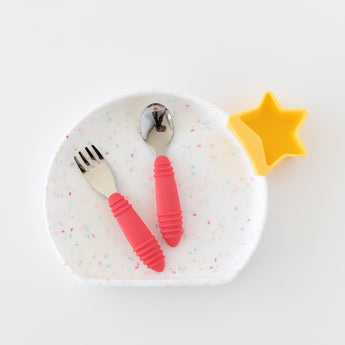 Bumkins Silicone Grip Plate: Vanilla Sprinkle with a red fork and spoon inside, and a yellow star-shaped cup on a white background.