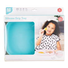 Load image into Gallery viewer, Bumkins Silicone Grip Tray: Blue in a white packaging box with a photo of a child and a clear window partially displaying the dish.
