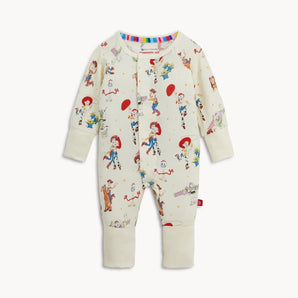 Magnetic, Coverall Toy Story Woody & Friends: cream long sleeve pajamas with Toy Story character design & magnetic closure; made of TENCEL modal.