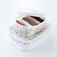 Load image into Gallery viewer, Bumkins Packing Cube 2 Pack: Palm Daze sit stacked on a white background. The top cube is open, holding folded clothes.
