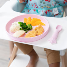 Load image into Gallery viewer, A child in a high chair with Bumkins Silicone Plate + Spoon Set: Disney Princess holding broccoli, potatoes, orange slices, and chicken nuggets.
